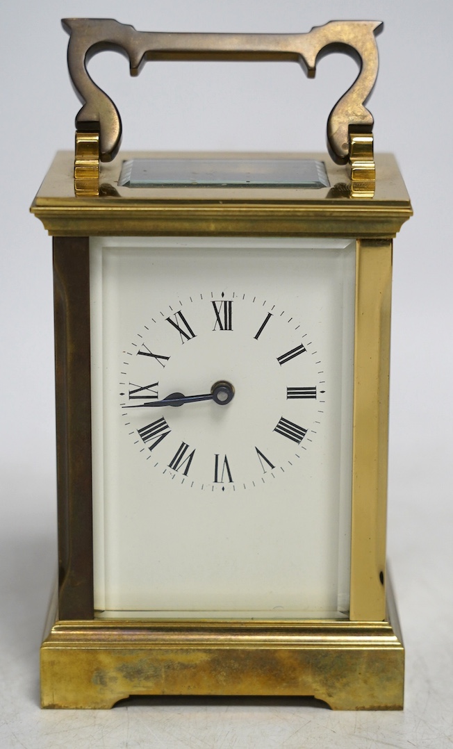 A carriage timepiece with white enamelled Roman dial, in a gilt brass and glazed case, 13cm. Condition - fair to good, not tested as working